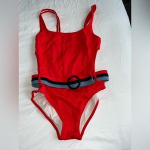 Solid and striped bathing suit, size medium. Never worn